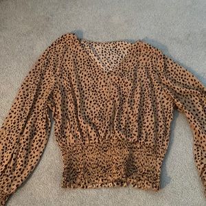 Long sleeve feeling blouse, cheetah print no stains or rips NEVER BEFORE WORN